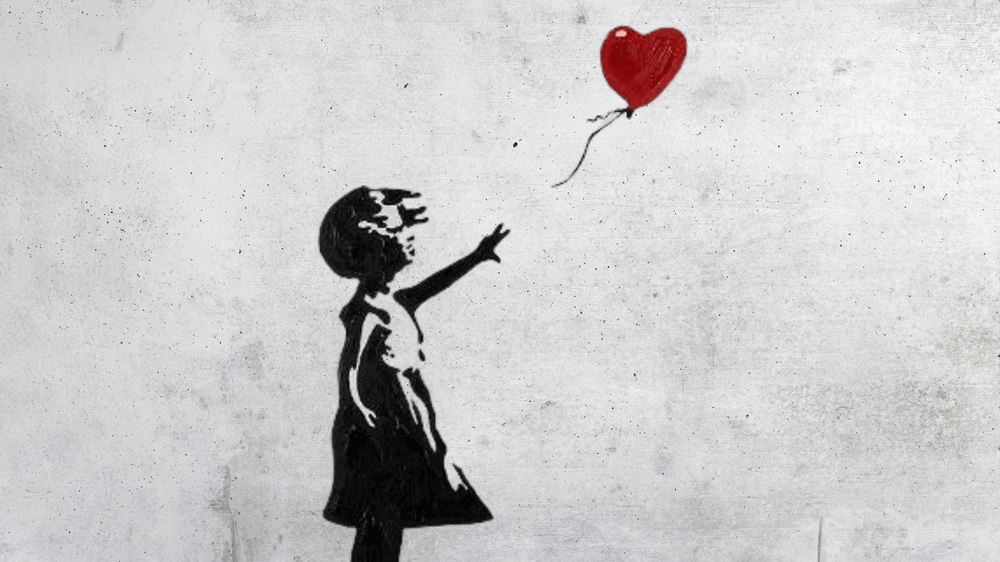 Banksy's graffiti girl with balloon
