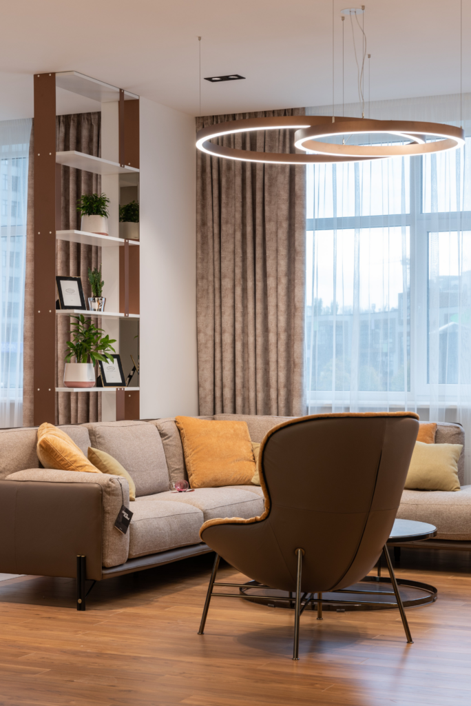 A large window in the living room that reflects direct sunlight