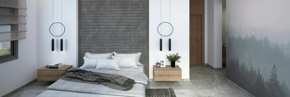 A bedroom with nature themed wallpaper on the side and a gray motif headboard