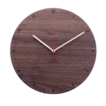 A dark wooden Designer clock 'Bergtouhr (nutwood round)'