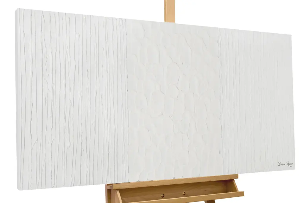 A large, blank white canvas with a subtle vertical texture resting on a wooden artist's easel.