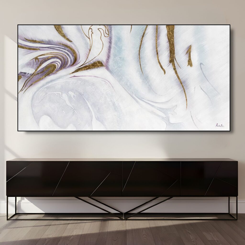A wide abstract art piece with marble-like swirls of white, blue, and gold hanging above a sleek black console table.